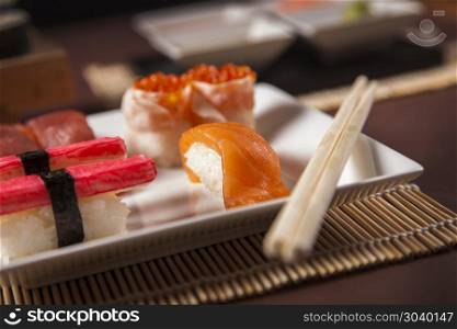 Variation of fresh tasty sushi food on table. Variation of fresh tasty sushi food on table. Studio shots