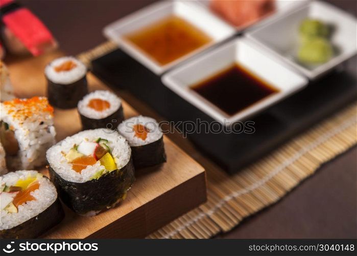 Variation of fresh tasty sushi food on table. Variation of fresh tasty sushi food on table. Studio shots