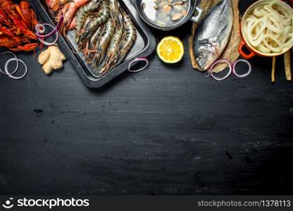 Varied fresh seafood. On the black chalkboard.. Varied fresh seafood.