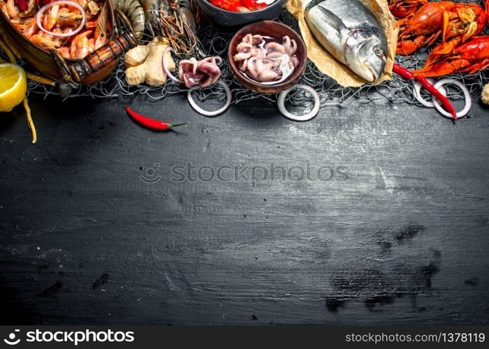 Varied fresh seafood. On the black chalkboard.. Varied fresh seafood.