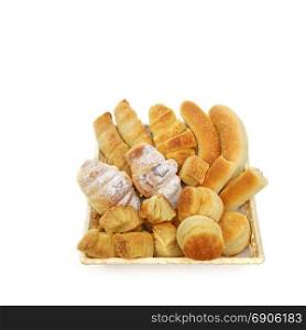 variety assortment of baked pastry products in a wicker or bread basket over white background