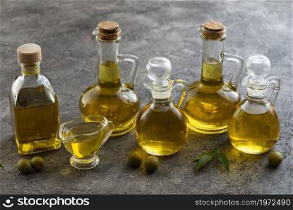 variety containers filled with olive oil. High resolution photo. variety containers filled with olive oil. High quality photo
