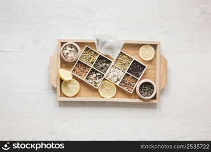 variety herbs dried chinese chrysanthemum flowers arranged small container wooden tray