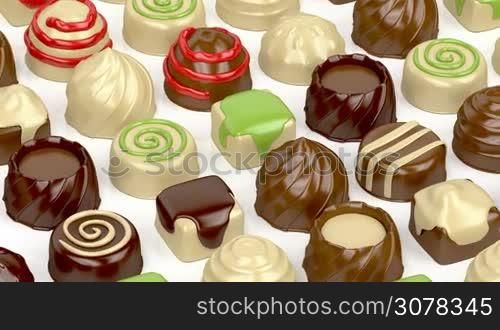 Variety of chocolate candies on white background