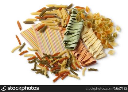 Variety of colorful traditional Italian pasta on white background