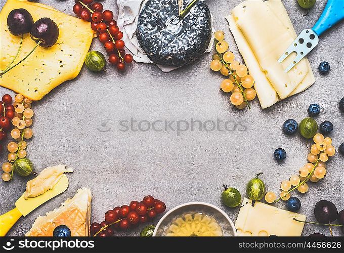 Variety of Delicious cheese with berries and honey for dessert or Breakfast on rustic background, top view, frame
