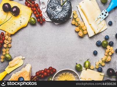 Variety of Delicious cheese with berries and honey for dessert or Breakfast on rustic background, top view, frame