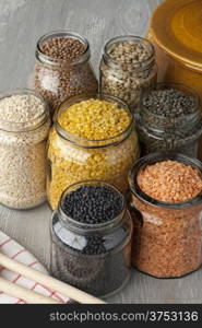Variety of dried lentils in glass pots