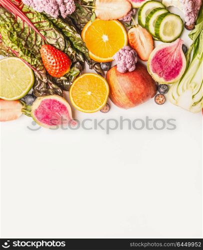 Variety of fresh colorful fruits and vegetables on white background, top view, border. Healthy food and clean eating concept