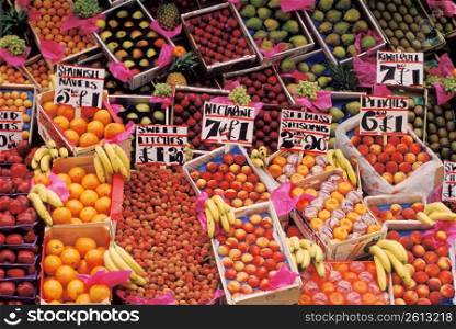 Variety of fresh fruit and price cards at market