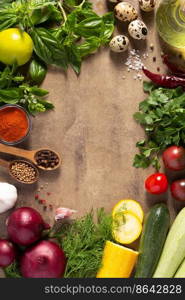 Variety of fresh vegetables on table background. Cooking concept and salad ingredients at tabletop top view