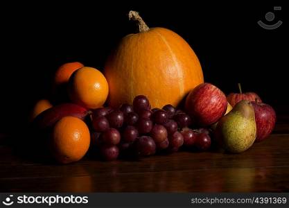 variety of fruits on a wooden table, studio picture