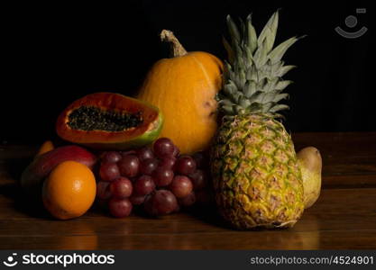 variety of fruits on a wooden table, studio picture