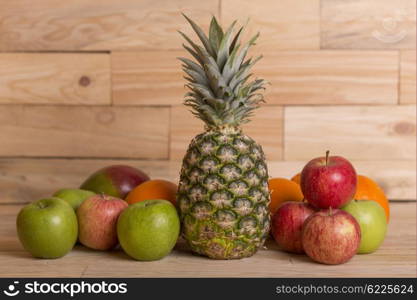 variety of fruits on a wooden table, studio picture