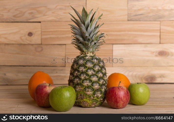 variety of fruits on a wooden table, studio picture