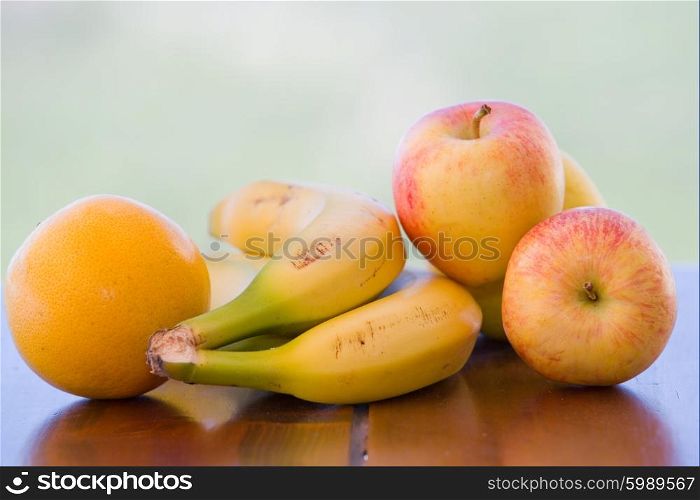 variety of fruits on table in the garden