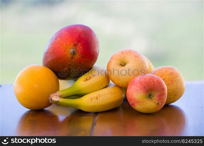 variety of fruits on table in the garden