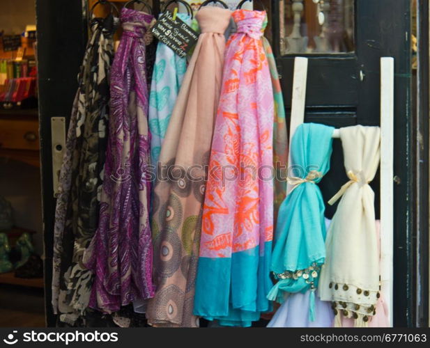 Variety of silk scarfs on display for sale