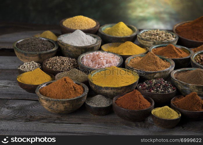 Variety of spices and herbs on kitchen table