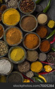 Variety of spices and herbs on kitchen table