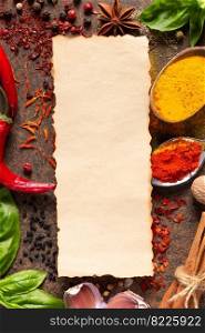 Variety of spices and herbs with paper label on table background. Cooking concept and ingredients at table top view