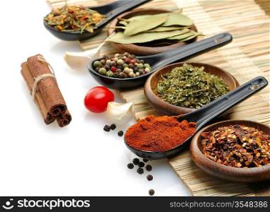 Variety Of Spices In Spoons And Bowls