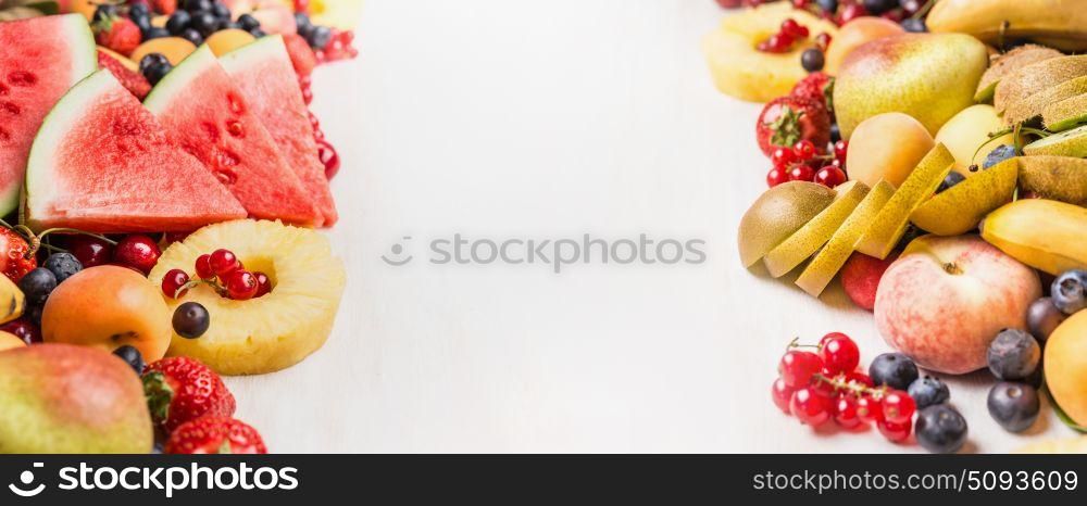 Variety of summer fruits and berries on white table background, banner. Healthy food and vegetarian eating concept