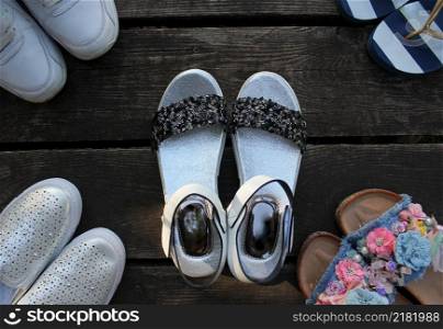 Variety of trendy woman&rsquo;s summer shoes. Flat-lay of espadrilles, sandals, flip flops, top view. Summer season footwear apparel concept .. Variety of trendy woman&rsquo;s summer shoes. Flat-lay of espadrilles, sandals, flip flops, top view. Summer season footwear apparel concept