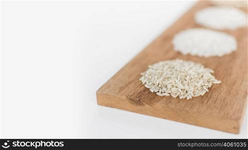variety rice wooden tray white background