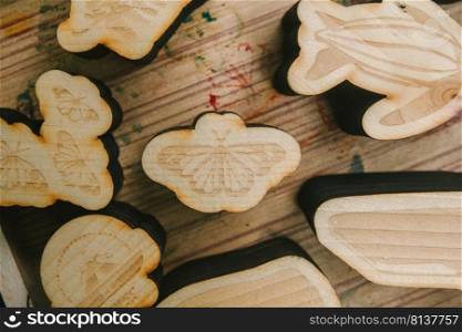 Variety wooden blocks on wooden floor. . Variety wooden blocks.