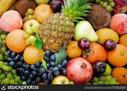 Various assorted juicy fruits. Fresh fruits colorful background.