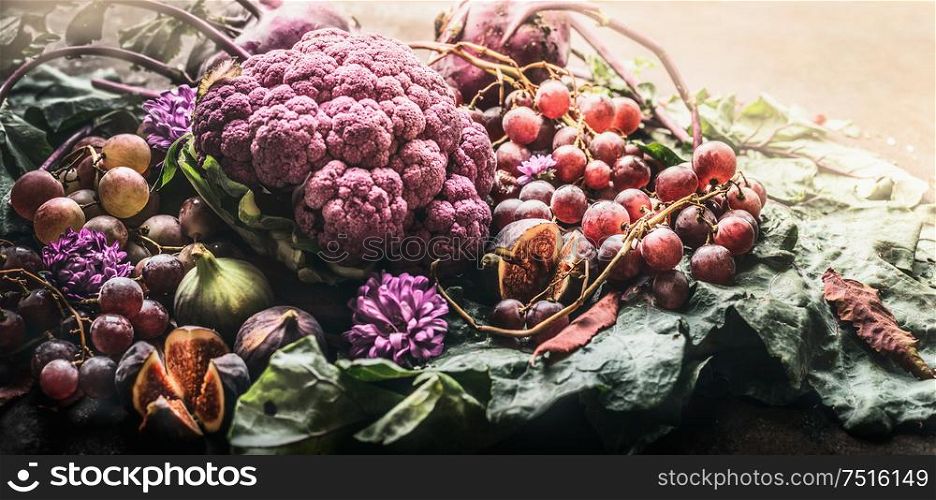 Various autumn purple fruits and vegetables, close up