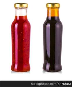 various barbecue sauces in glass bottles on white background