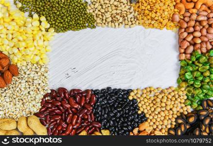 Various beans mix peas agriculture of natural healthy food for cooking ingredients / Set of different whole grains beans and legumes seeds lentils and nuts colorful snack background , top view