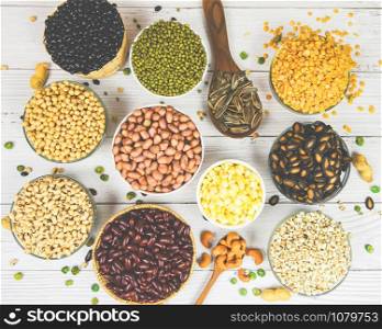 Various beans mix peas agriculture of natural healthy food for cooking ingredients / Different whole grains beans on bowl and legumes seeds lentils and nuts colorful snack background , top view