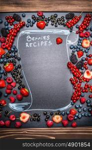 Various Berries frame with handwritten text lettering : Berries recipes, top view, place for text