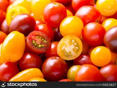 various cherry tomatoes as background