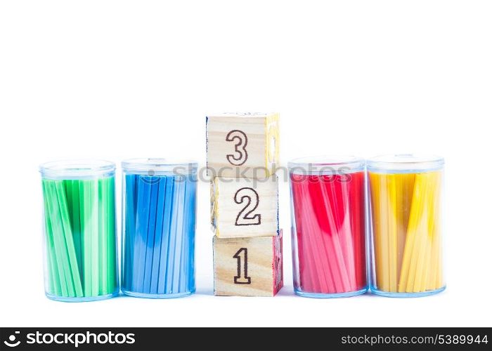 Various color counting sticks wooden cubes with digits isolated