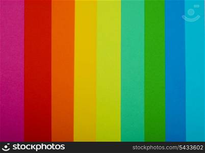 various color paper stack like a rainbow close up
