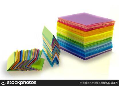 various color paper stacks isolated on white