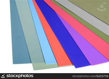 various color silk paper stack like a rainbow isolated on white