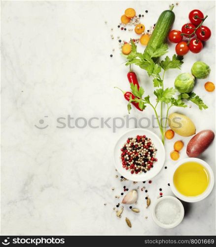 Various colorful spices and vegetables on marble table. Bio Healthy food, herbs and spices. Organic vegetables. Vegetarian food. Background layout with free text space.