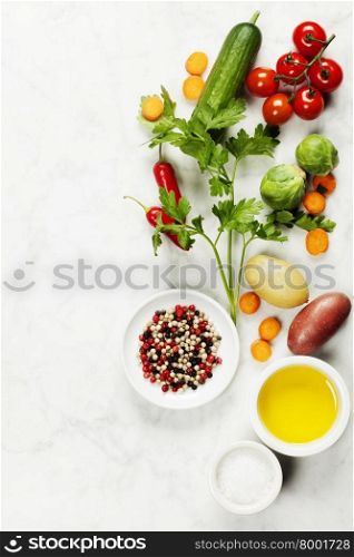Various colorful spices and vegetables on marble table. Bio Healthy food, herbs and spices. Organic vegetables. Vegetarian food.
