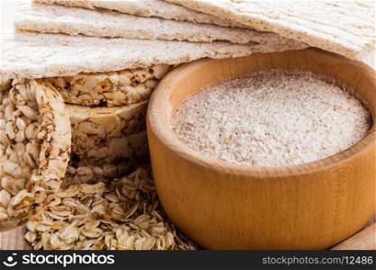 Various dietary oat products on wooden table