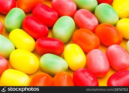 Various dry colourful sweets arranged as background