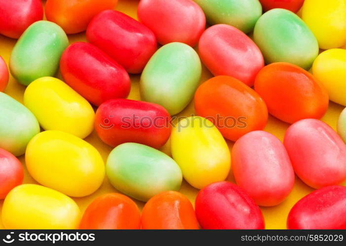 Various dry colourful sweets arranged as background