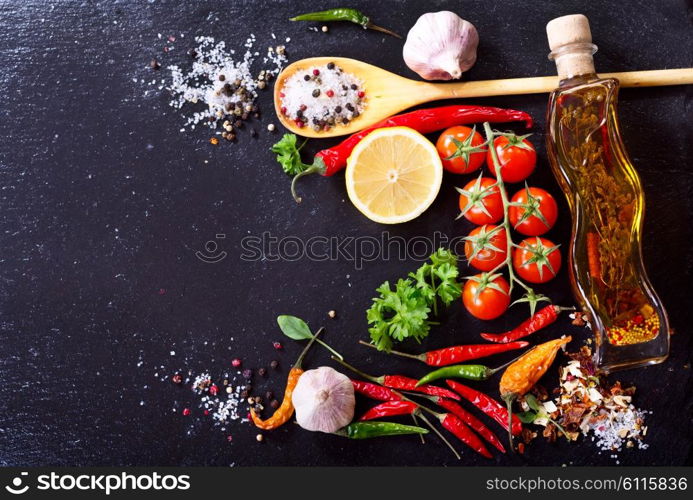 various food ingredients for cooking on dark board