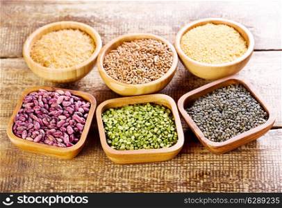 various food ingredients in a bowls on wooden table
