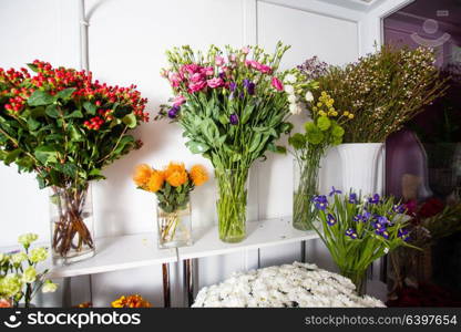 Various fresh flowers in the flower market. Bunches of flowers for sale