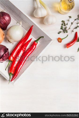 Various fresh spices and seasoning and condiment on white wooden background, top view. Healthy , clean food or vegetarian cooking and eating concept
